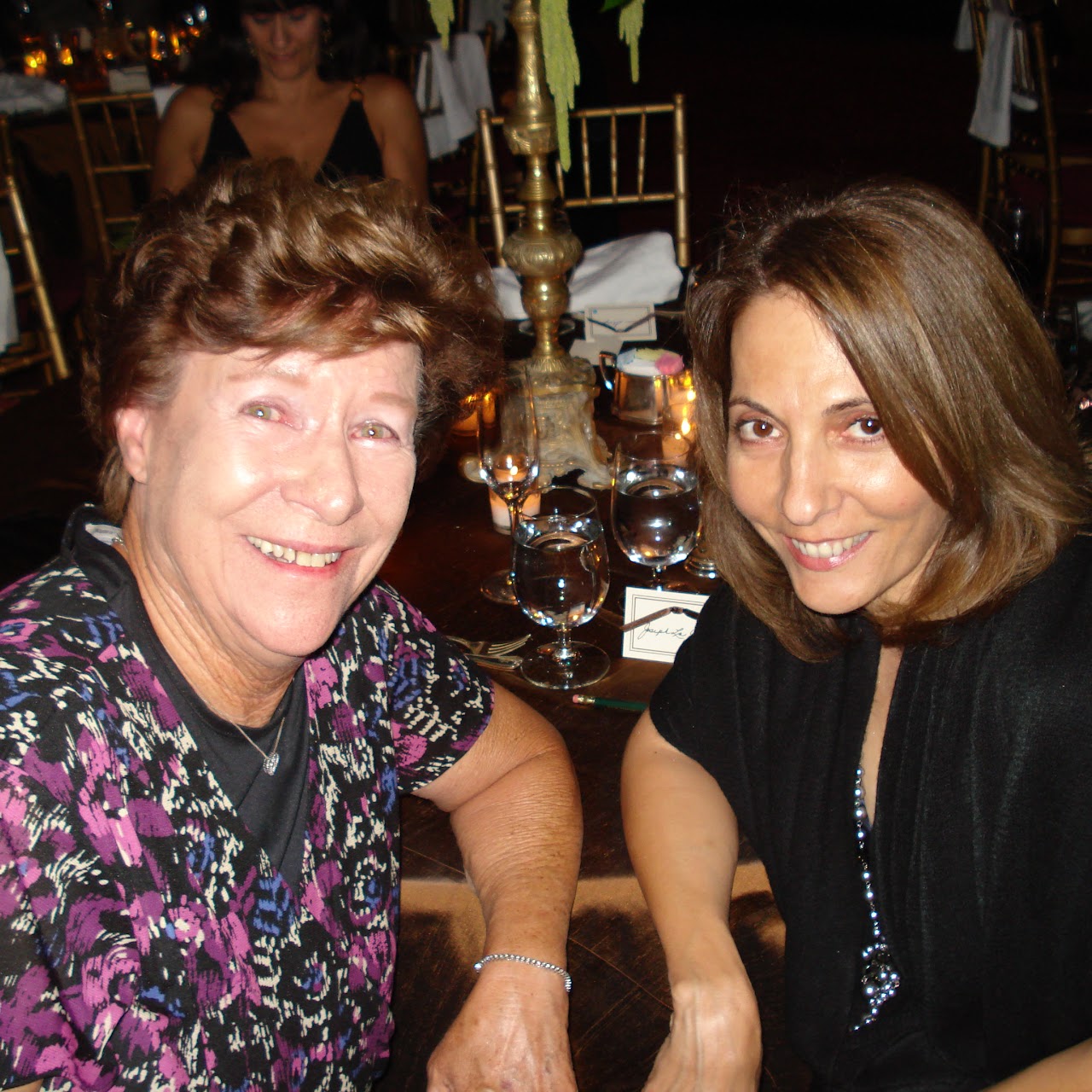 Formal event photo with Joanne and a loved one